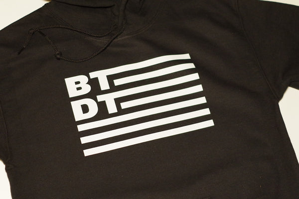 Black hooded sweatshirt with our flag logo across the entire chest. Let others know you've been there, done that!