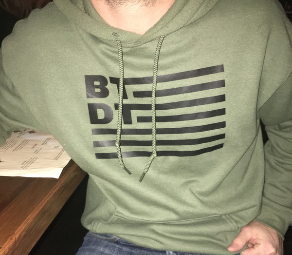Olive Green hooded sweatshirt with our flag logo across the entire chest. Let others know you've been there, done that!